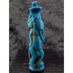 Egyptian faience amulet of Bes, dancing and playing the tamb